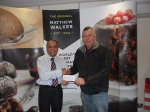 Rob Rainsford presenting the cheque